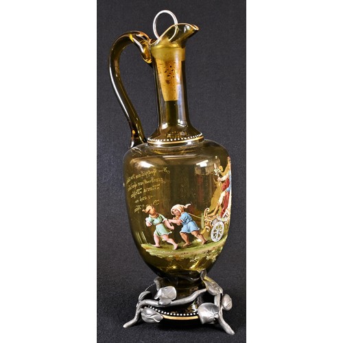 5137 - A German Secessionist pewter-mounted enamelled green glass claret jug, painted in polychrome enamel ... 