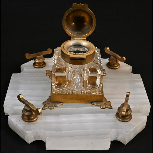 5277 - A Victorian Gothic Revival gilt brass and white onyx shaped square inkstand, Betjemann's patent well... 