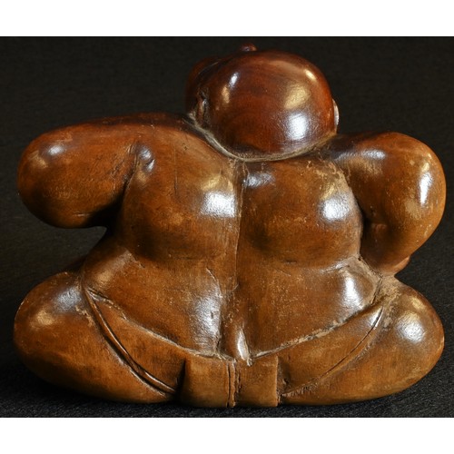 5155 - A Japanese two-tone hardwood carving, of a sumo wrestler, 8cm high, 11cm wide, Meiji period