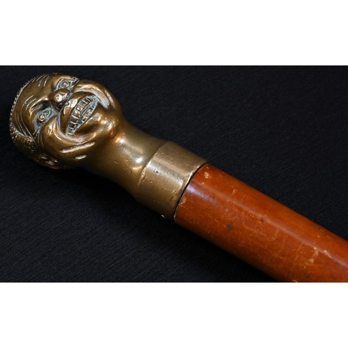 5342 - An early 20th century malacca novelty walking stick, the bronze pommel cast as the head of a man, gr... 