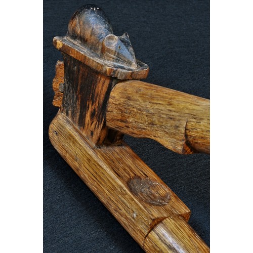 5473 - Robert Thompson, Mouseman of Kilburn - a pair of oak lever-action nut crackers, carved mouse signatu... 