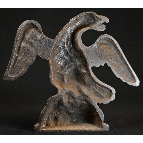 5014 - A 19th century cast iron door stop, as a spread eagle, 21cm wide