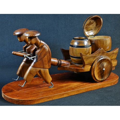 5310 - An Art Deco novelty tobacco compendium, as a pair of Chinese figures drawing a hand cart with two ba... 