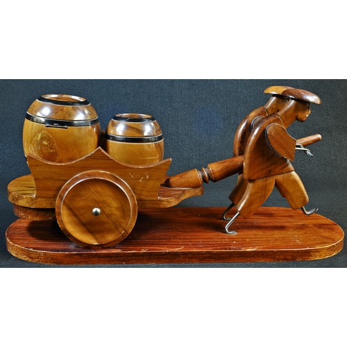 5310 - An Art Deco novelty tobacco compendium, as a pair of Chinese figures drawing a hand cart with two ba... 