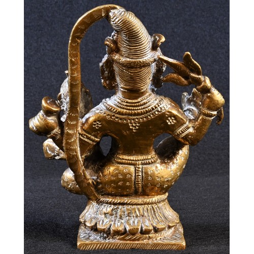 5373 - An Indian gilt bronze shrine figure, of Vishnu holding an infant, 13cm high, 19th century