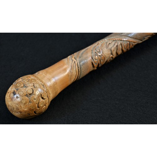 5150 - A Japanese bamboo walking stick, carved in relief with ferocious dragons amongst scrolling clouds, 8... 