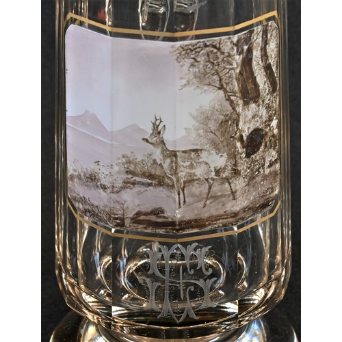 5135 - A German glass beer stein, decorated with deer in a landscape, pewter cover, 26cm high, c.1900