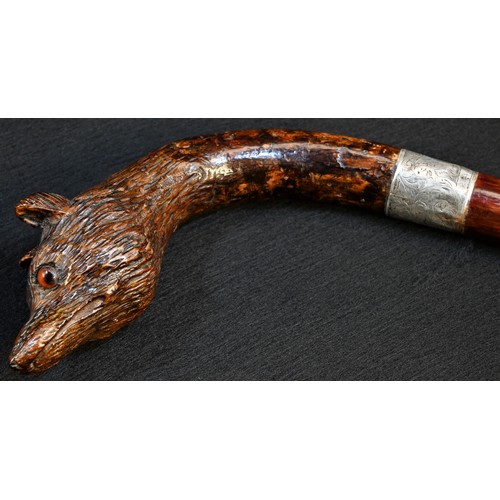 5079 - A Black Forest gentleman's novelty walking cane, the curved handle carved as the head of a fox, glas... 