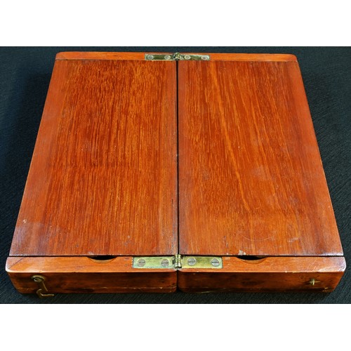 5360 - An Edwardian mahogany travelling chess set, folding diptych board, 21cm wide, c.1910