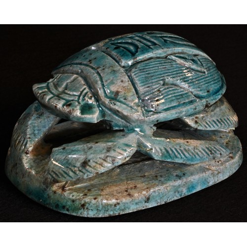 5364 - An Egyptian Grand Tour turquoise faience model, of a scarab beetle, 9cm long