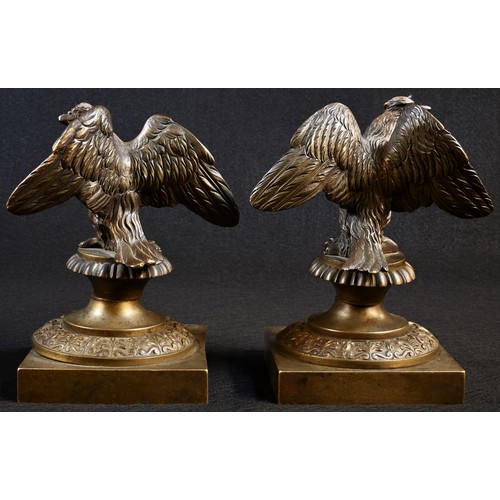 5200 - A pair of 19th century bronze desk models, each cast as an Imperial eagle, anthemion socles, square ... 