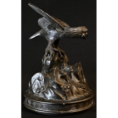 5442 - Japanese School (Meiji period), a dark patinated bronze, of an eagle perched on a rocky outcrop, 15c... 