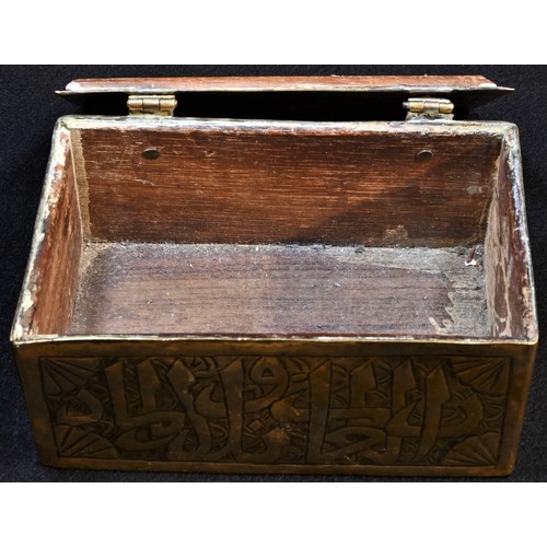 5183 - A Middle Eastern brass rectangular box, chased in the Islamic taste with Arabic calligraphy, a styli... 