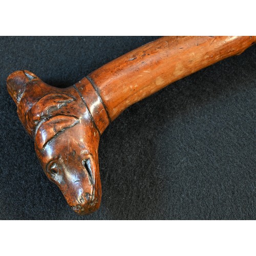 5511 - A 19th century fruitwood gentleman's novelty walking stick, the 'janus' pommel carved with two dogs'... 