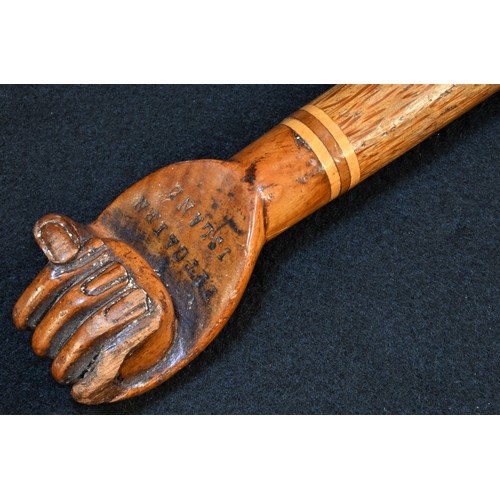 5514 - A South Seas novelty walking stick, the hardwood pommel carved as a fist and stamped Pitcairn Island... 