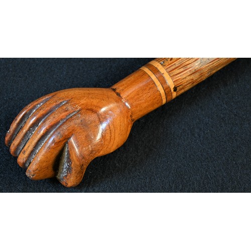 5514 - A South Seas novelty walking stick, the hardwood pommel carved as a fist and stamped Pitcairn Island... 