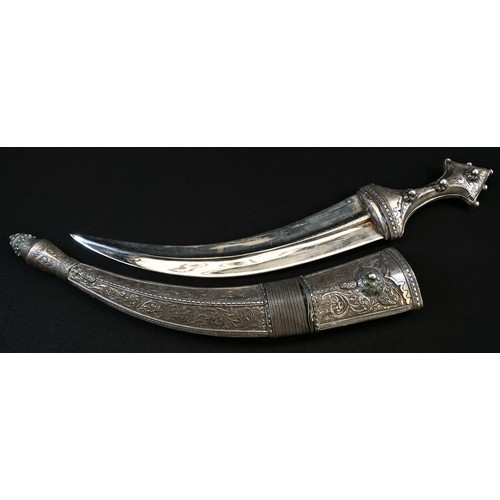 5620 - A Middle Eastern silver coloured metal jambiya dagger, 28.5cm curved blade with diapers to spine, th... 