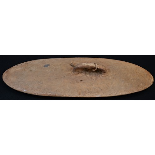 5771 - Tribal Art - an Australian Aboriginal shield, carved with a figure hunting a kangaroo, outlined with... 