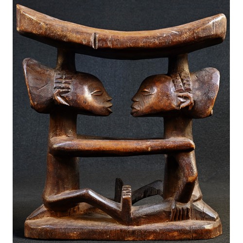 5753 - Tribal Art - a Luba caryatid headrest, carved with two figures embracing, elaborate coiffure,18cm hi... 