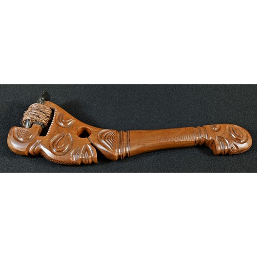 5756 - Tribal Art - a Polynesian hardwood axe, carved as a stylised figure, the stone head bound with cord,... 