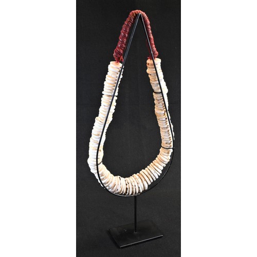 5752 - Tribal Art - a large Papua New Guinea conus shell currency necklace, 37cm drop