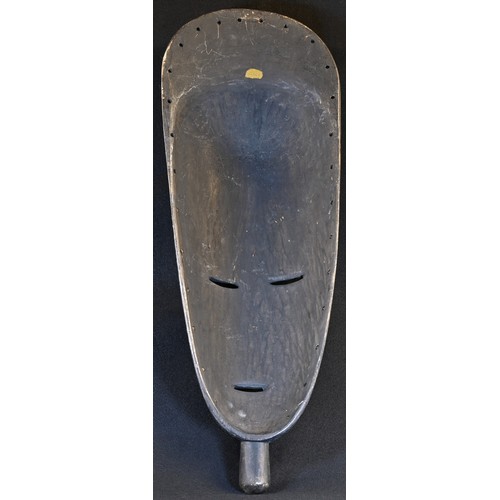 5750 - Tribal Art - a large African mask, domed forehead with central ridge, 68cm long