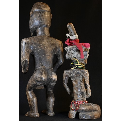 5764 - Tribal Art - an African figure, possibly Democratic Republic of Congo, crouching, with scarified fea... 