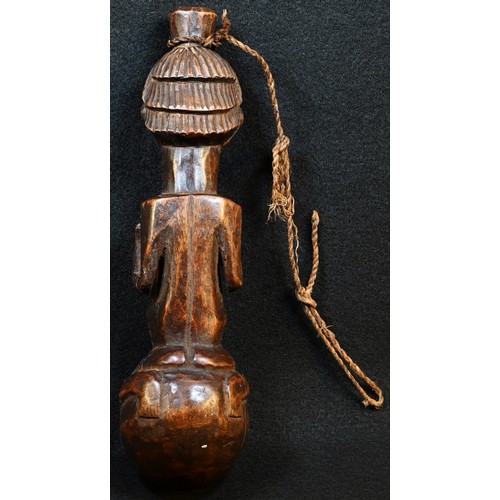 5754 - Tribal Art - a Luba or Baluba figural pipe, carved with a naked woman straddling a sphere, 21cm long... 