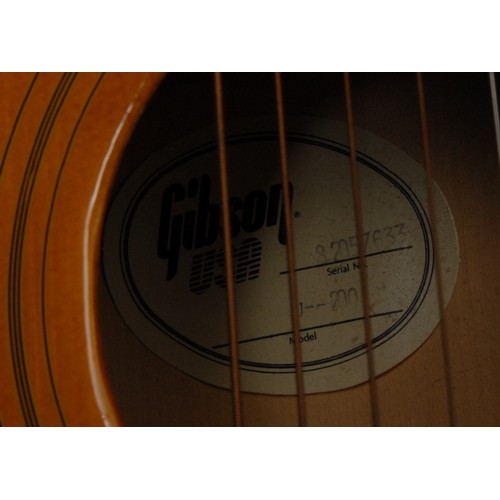 5285B - A Gibson J200 acoustic guitar, USA, natural tobacco sunburst finish, gold hardwear. Serial number SE... 