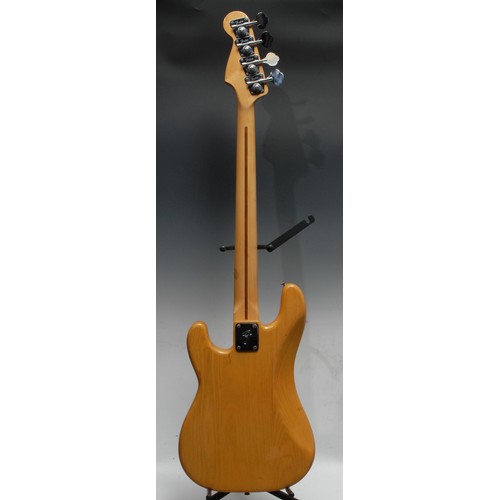 5285H - A Fender Precision electric bass guitar USA, natural wood body, maple neck, black pickguard. Serial ... 