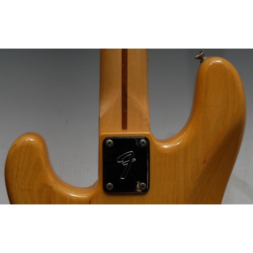 5285H - A Fender Precision electric bass guitar USA, natural wood body, maple neck, black pickguard. Serial ... 