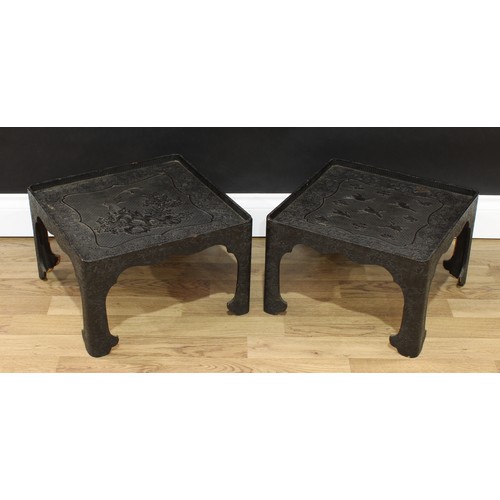 1514 - A pair of Chinese black cinnabar lacquer rounded square low tables, decorated in relief with cranes ... 