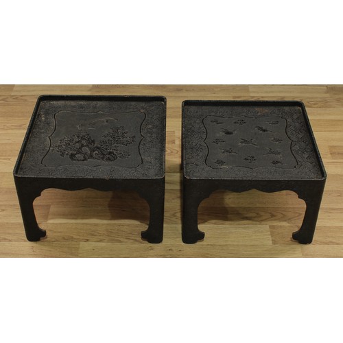 1514 - A pair of Chinese black cinnabar lacquer rounded square low tables, decorated in relief with cranes ... 