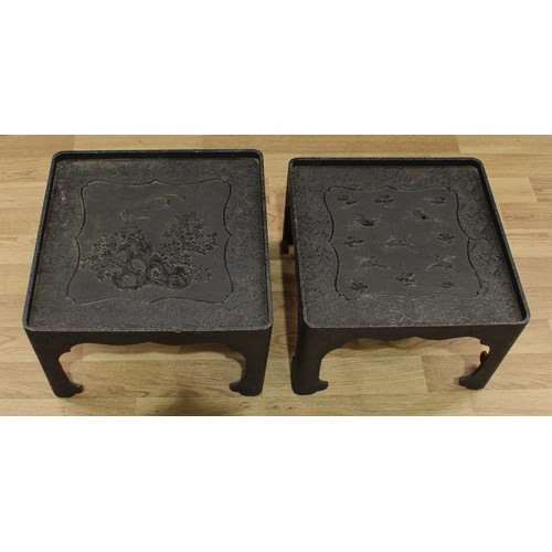 1514 - A pair of Chinese black cinnabar lacquer rounded square low tables, decorated in relief with cranes ... 