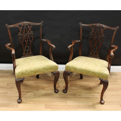 1518 - A pair of Chippendale design mahogany armchairs, shaped cresting rails and pierced interlaced splats... 