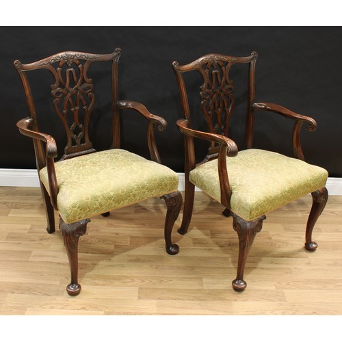 1518 - A pair of Chippendale design mahogany armchairs, shaped cresting rails and pierced interlaced splats... 