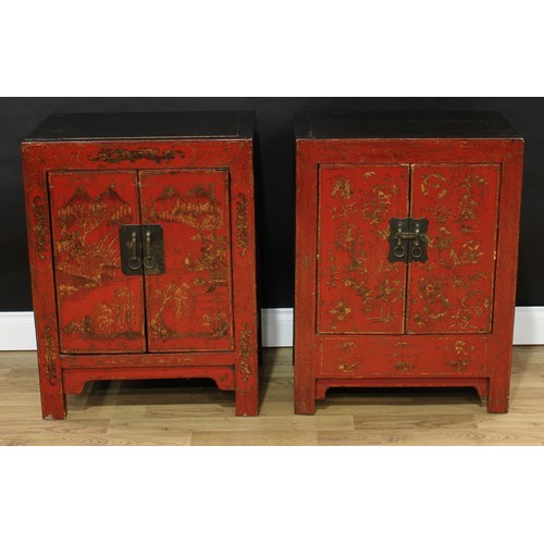 1517 - A pair of Chinese red lacquer side cabinets, each with a pair of doors, decorated with monumental la... 