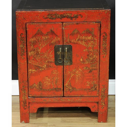 1517 - A pair of Chinese red lacquer side cabinets, each with a pair of doors, decorated with monumental la... 