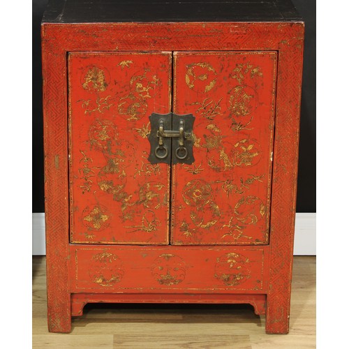 1517 - A pair of Chinese red lacquer side cabinets, each with a pair of doors, decorated with monumental la... 