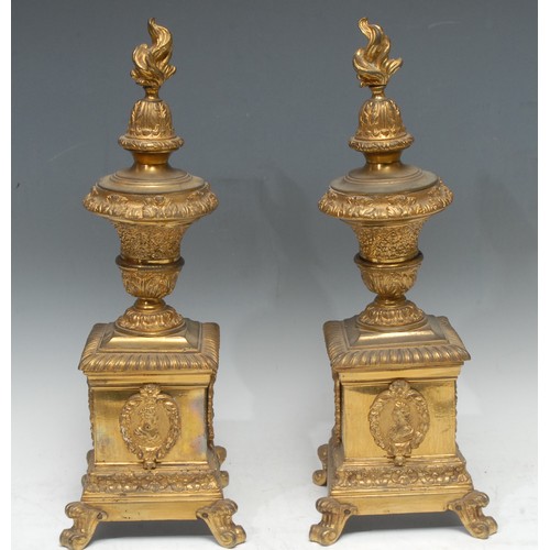 1507 - A pair of 19th century gilt brass andirons, flame finials, pedestal bases, 44cm high, c.1870