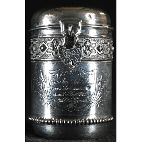 68 - A 19th century German silver cylindrical money box, acanthus-capped scroll handle, embossed with a b... 