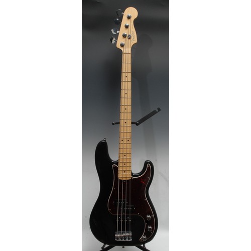 1497 - A Fender Precision electric bass guitar, Corona Ca. USA, black body, maple neck, red tortoishell pic... 