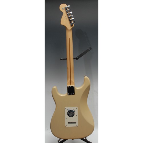 1498 - A Fender Stratocaster electric guitar, USA honey blonde, maple neck, rosewood finger board. Serial n... 