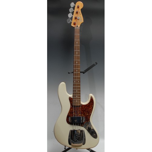 1497A - A Fender Jazz electric bass guitar, made in Korea,  serial no. E1047713, Olympic White gloss finish ... 