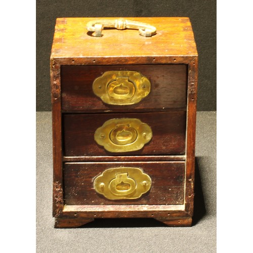 32 - A Chinese hardwood table top cabinet, shaped brass handle above three drawers, bracket feet, 18cm hi... 