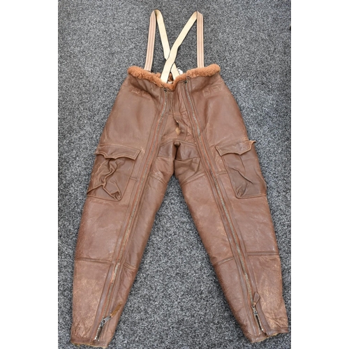 3086 - World War II - a pair Royal Air Force leather flying trousers, with braces, stitched label dated 194... 