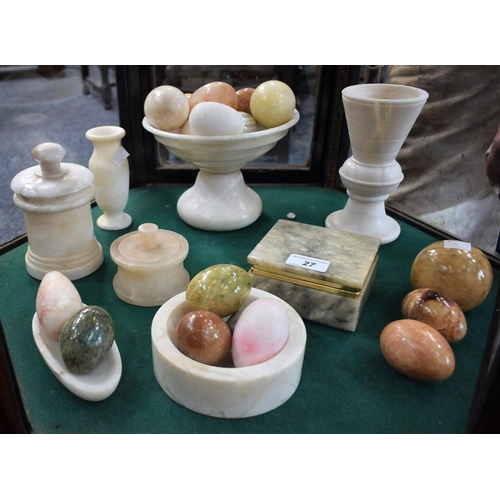 27 - A quantity of polished stone eggs, variety of colours and sizes; an alabaster lidded jar; an alabast... 