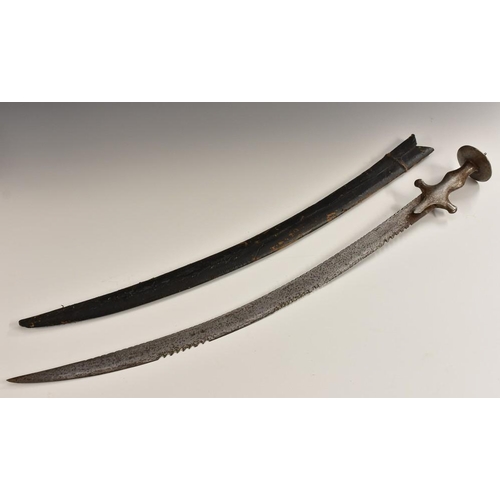 3250 - An Indian tulwar, 70cm curved blade with serrated 'saw' sections, steel hilt with spiked disc pommel... 