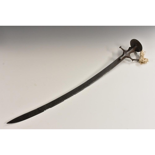 3254 - An Indian tulwar, 72cm curved serrated blade, iron knuckle bow guard with spiked disc pommel, 85cm l... 