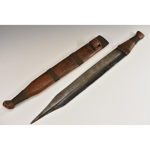 3273 - Tribal Art - a Shona bakatwa dagger, 37.5cm blade, the hardwood grip and scabbard with copper wire b... 